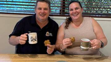Amanda Turner shares a batch of ANZAC biscuits with Mt Isa RSL president Troy Hartas, a 20 year veteran who served in the Royal Australian Navy and retired a petty officer systems supervisor operator. Picture: Supplied