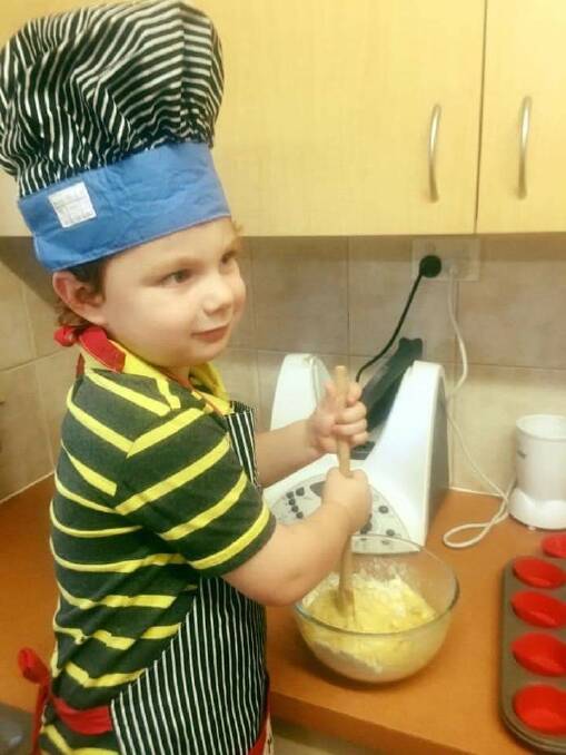 Little Archer in the kitchen. 