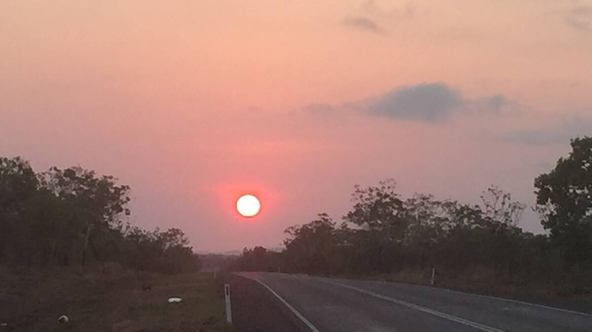 RUN SUN: The red sun on the Stuart Highway heading towards Katherine this morning.