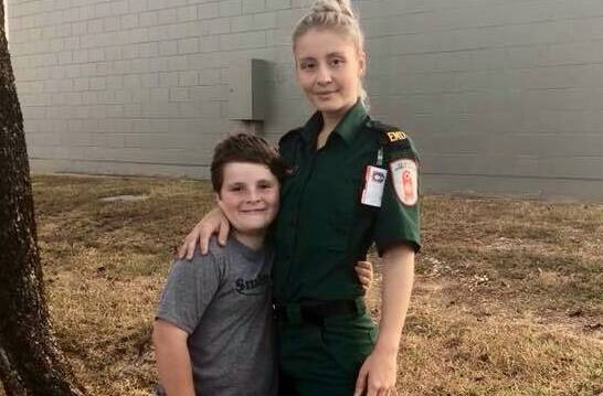 St John Ambulance Emergency Medical Dispatcher Bianca Stubbs with her brother Brodie, 10, who suffered serious burns when a firecracker exploded in his pram when he was 14 months old. Picture: St Johns.