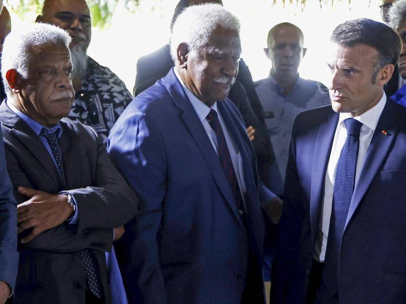 French President Emmanuel Macron (right) is meeting with elected officials in New Caledonia. (AP PHOTO)
